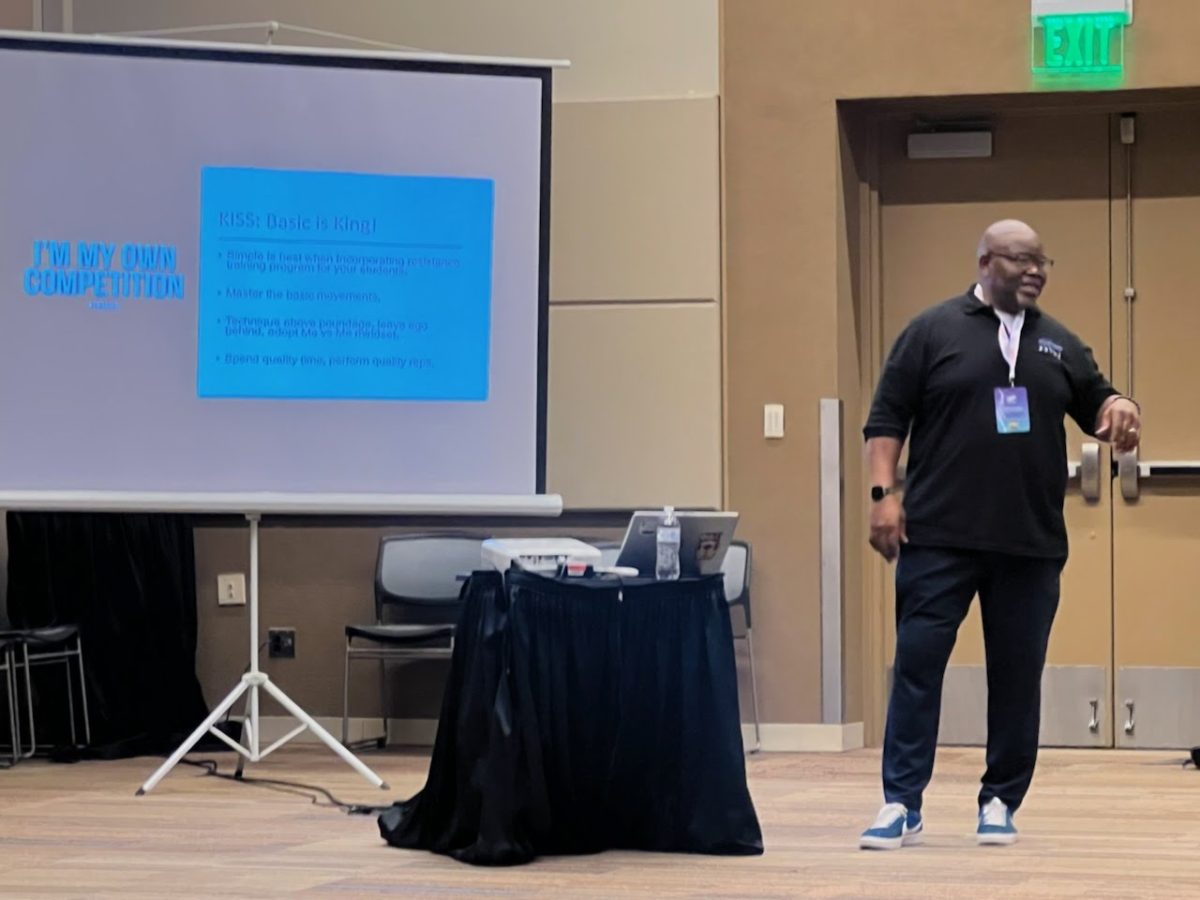 Shawn Jenkins speaking to a seated group